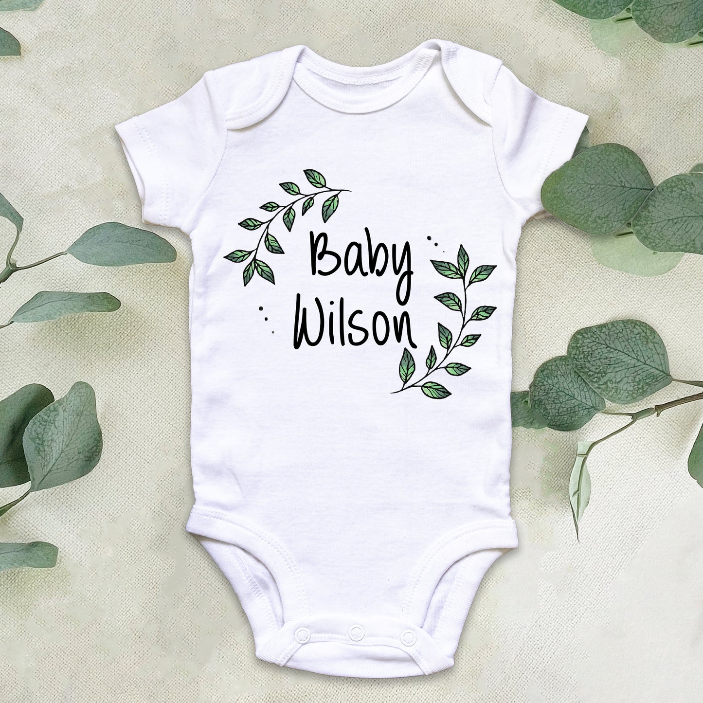 Personalised Baby Surname Botanical Leaf Wreath Baby Grow Vest