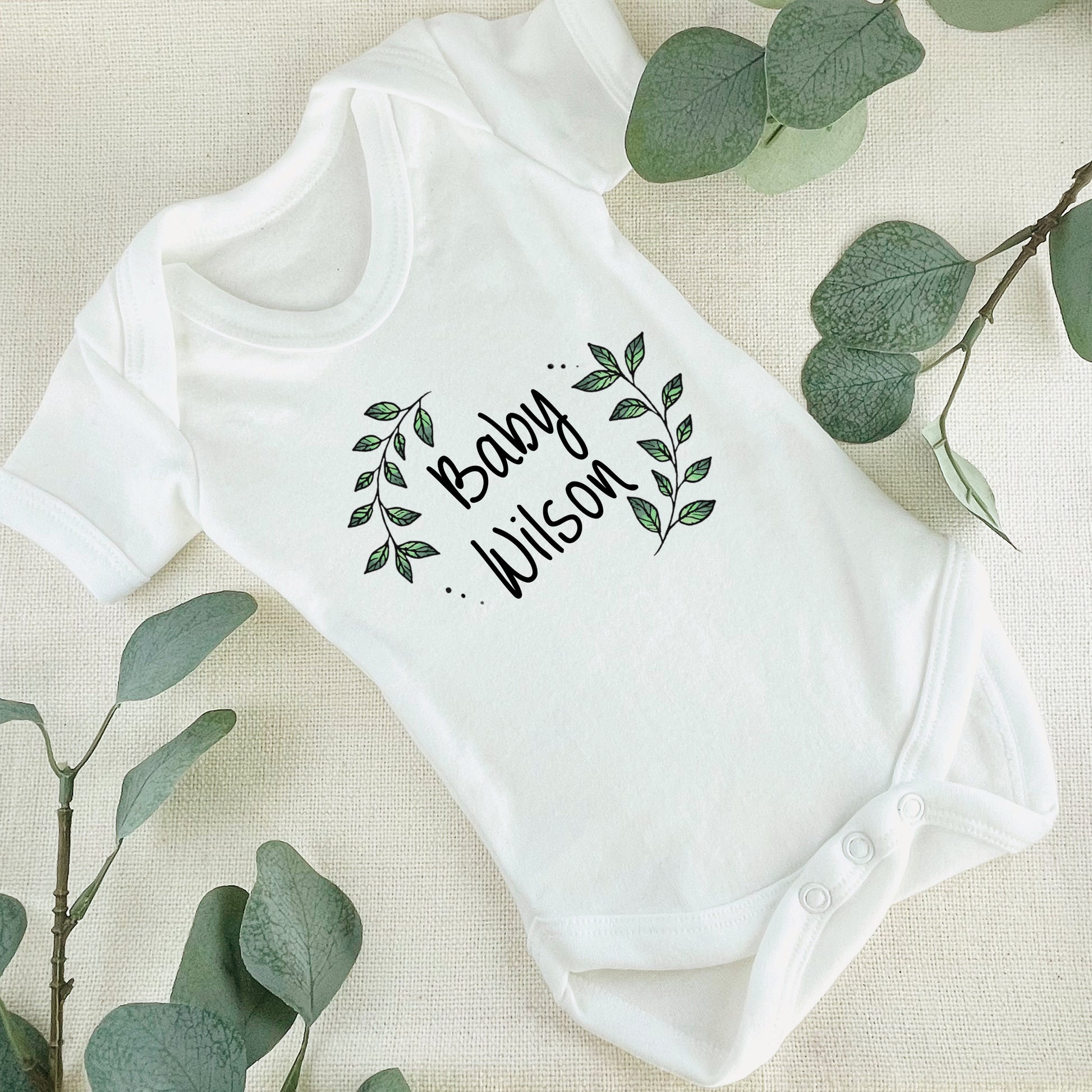 Personalised Baby Surname Botanical Leaf Wreath Baby Grow Vest